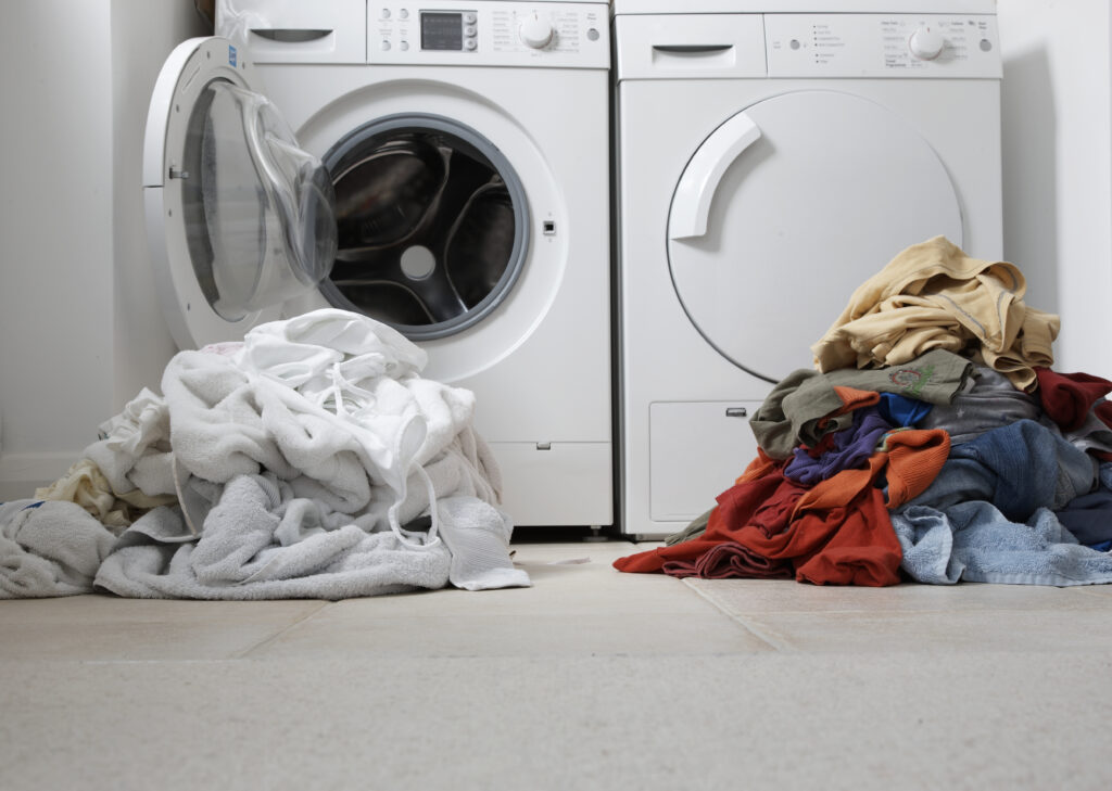 What are the benefits of sorting laundry before washing and drying